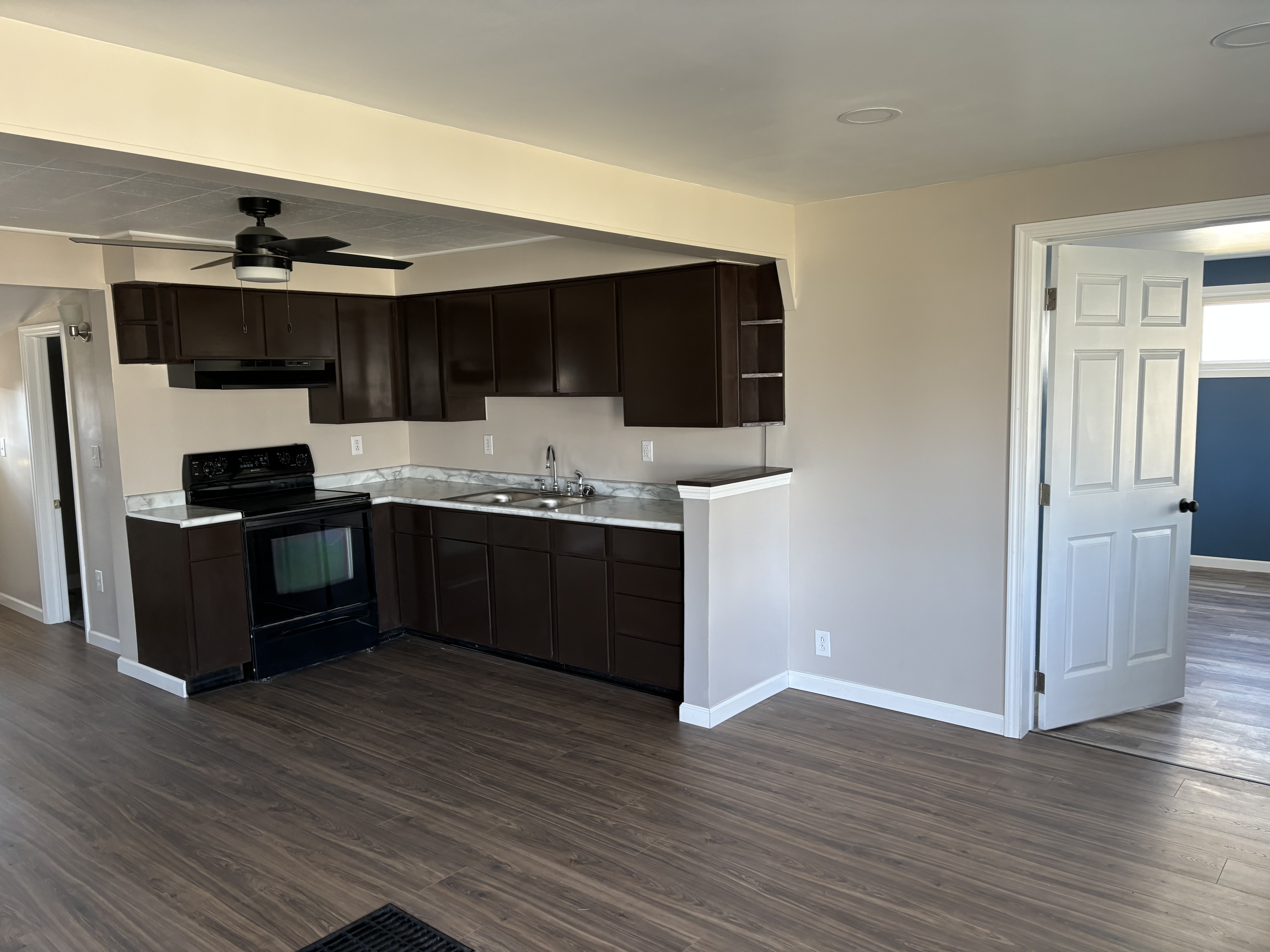 Kitchen with dark cabinetry