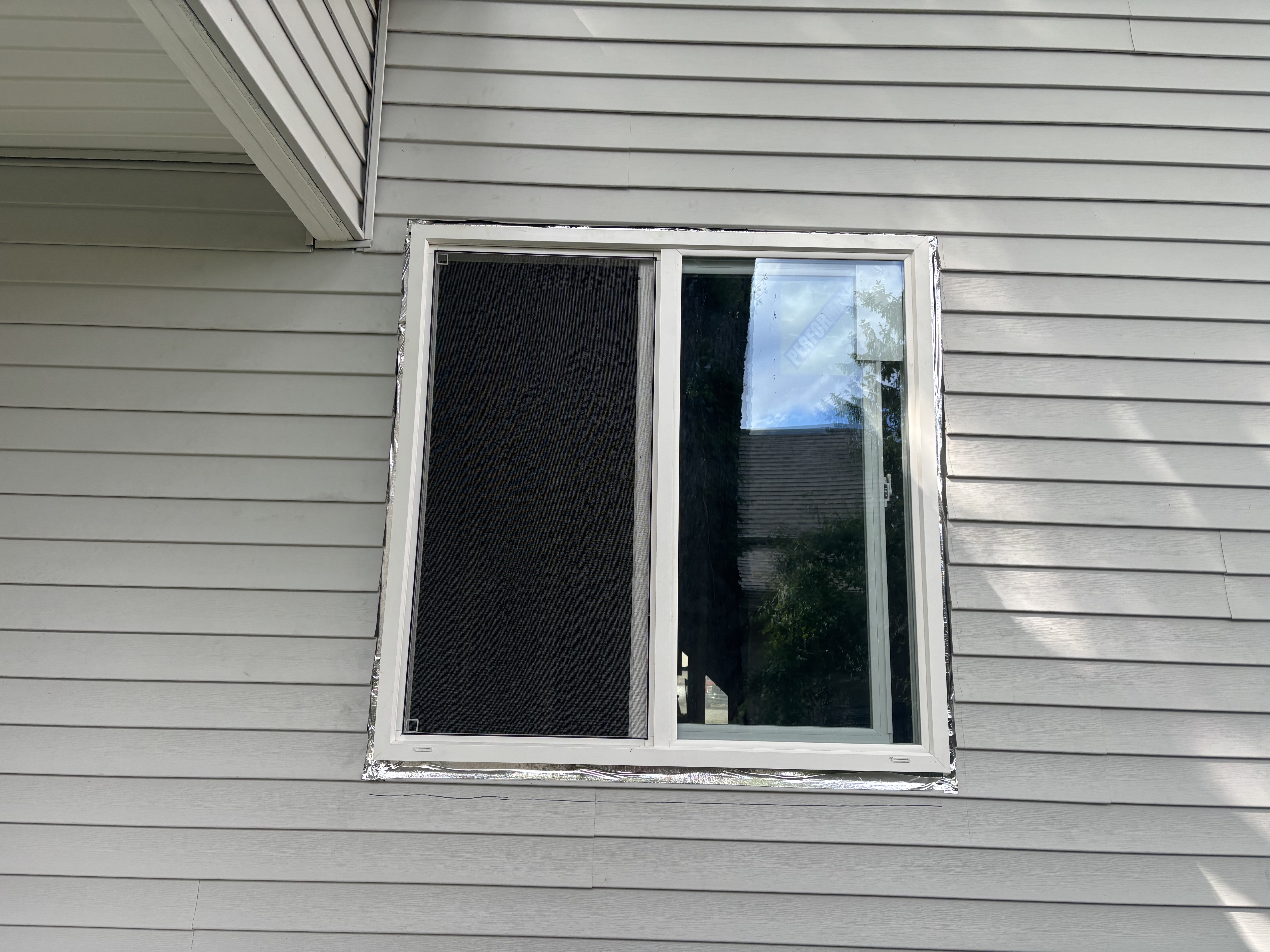 Replacement window on vinyl-sided home